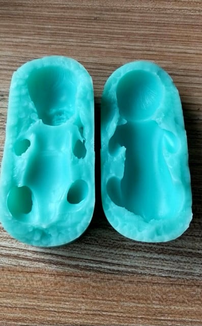 Newborn baby with elbows up. Silicone mold also for candles.